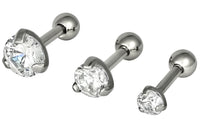 This set of three cartilage stud earrings feature clear round Cubic Zirconia crystals. The gems measure 3 mm, 4 mm and 5 mm in diameter. When worn together, these three cartilage studs create a unique and beautiful look on the ear. All three studs are 16 gauge and 1/4" barbell length. This cartilage jewelry is hypoallergenic and nickel free.