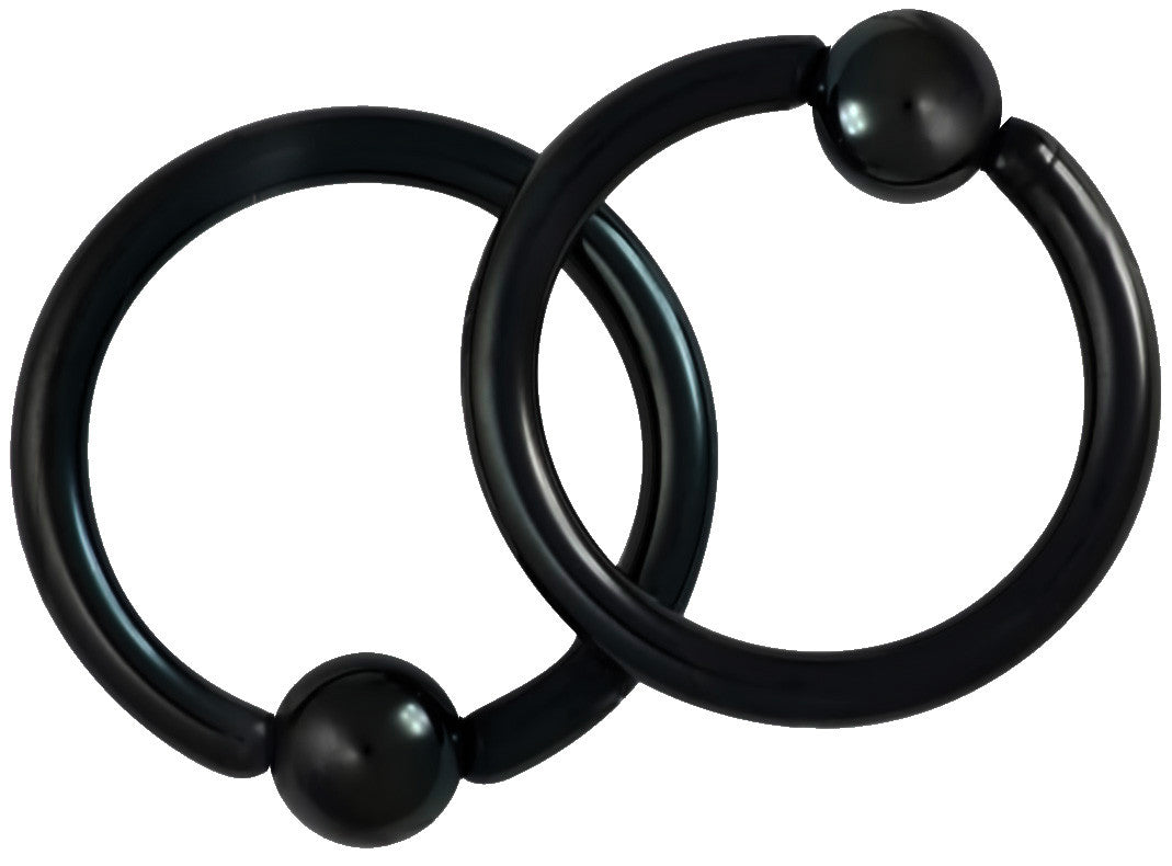 This pair of 14 gauge CBR ring is made with surgical grade 316L Stainless Steel and black Titanium IP plating. The rings are 1/2" (12 mm) in diameter with 5 mm balls.